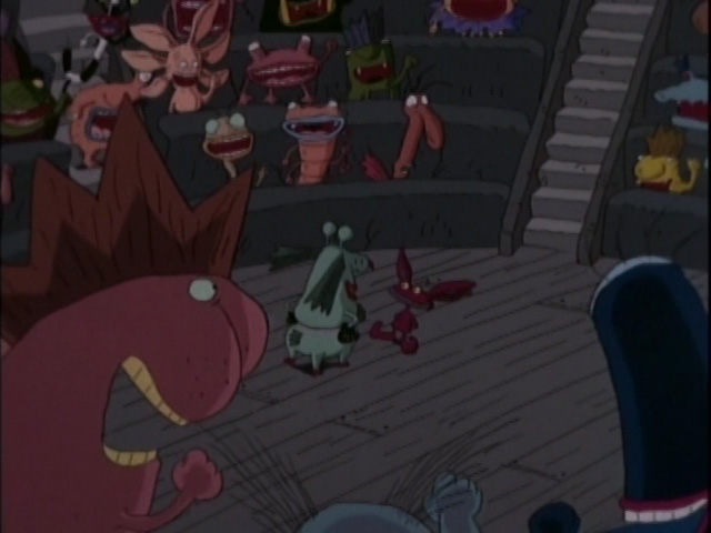 an image screencap of the gromble and ickis in a conversation surrounded by other monster students